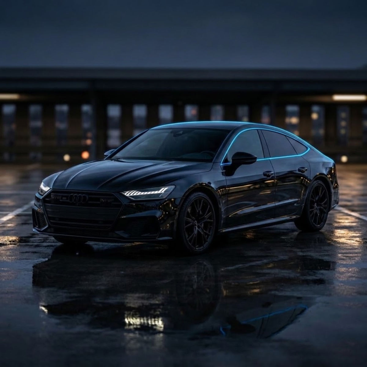A glossy black Audi sports sedan parked on a wet reflective surface at dusk, with blurred building lights in the background.