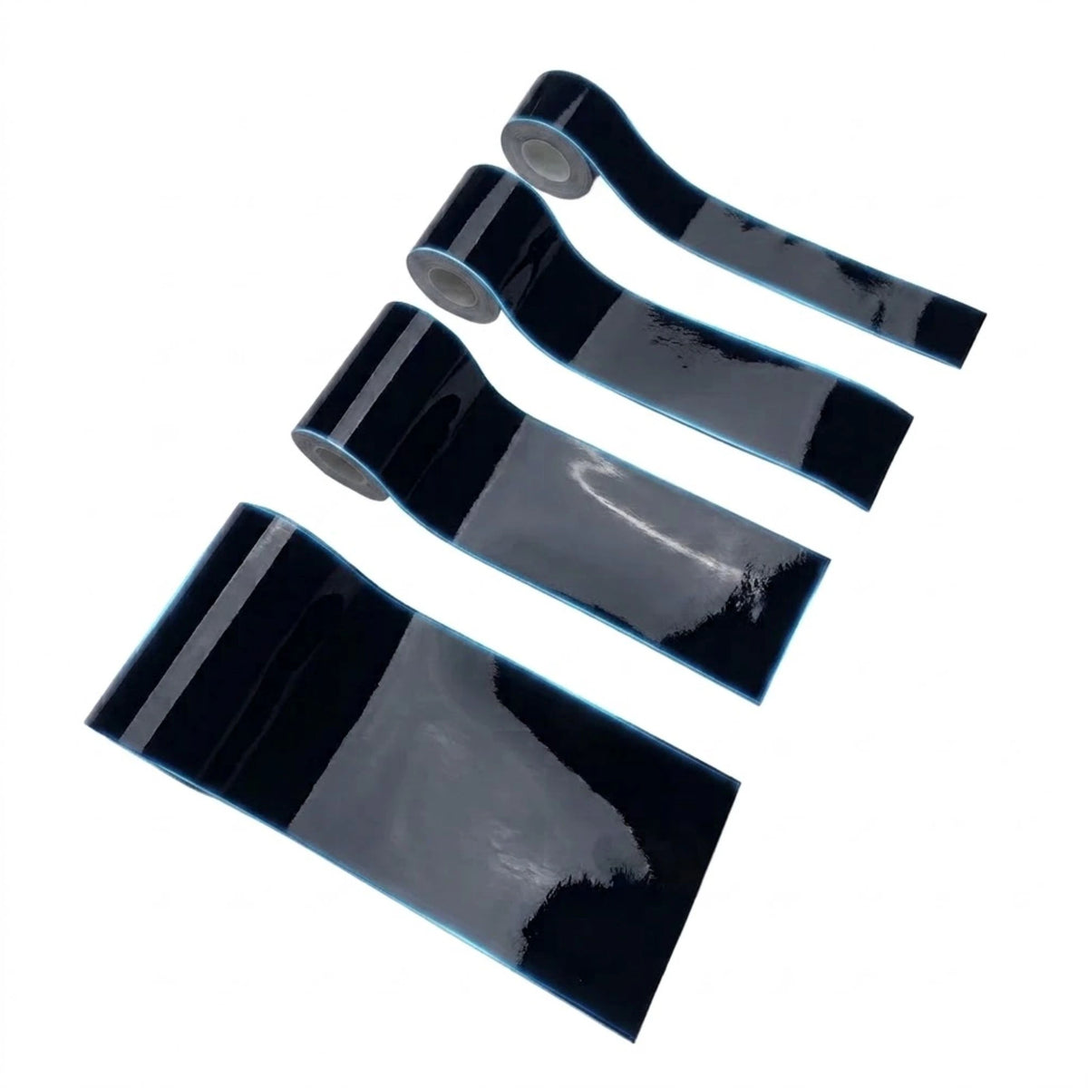 Four rolls of glossy black adhesive tape arranged diagonally on a plain white background.