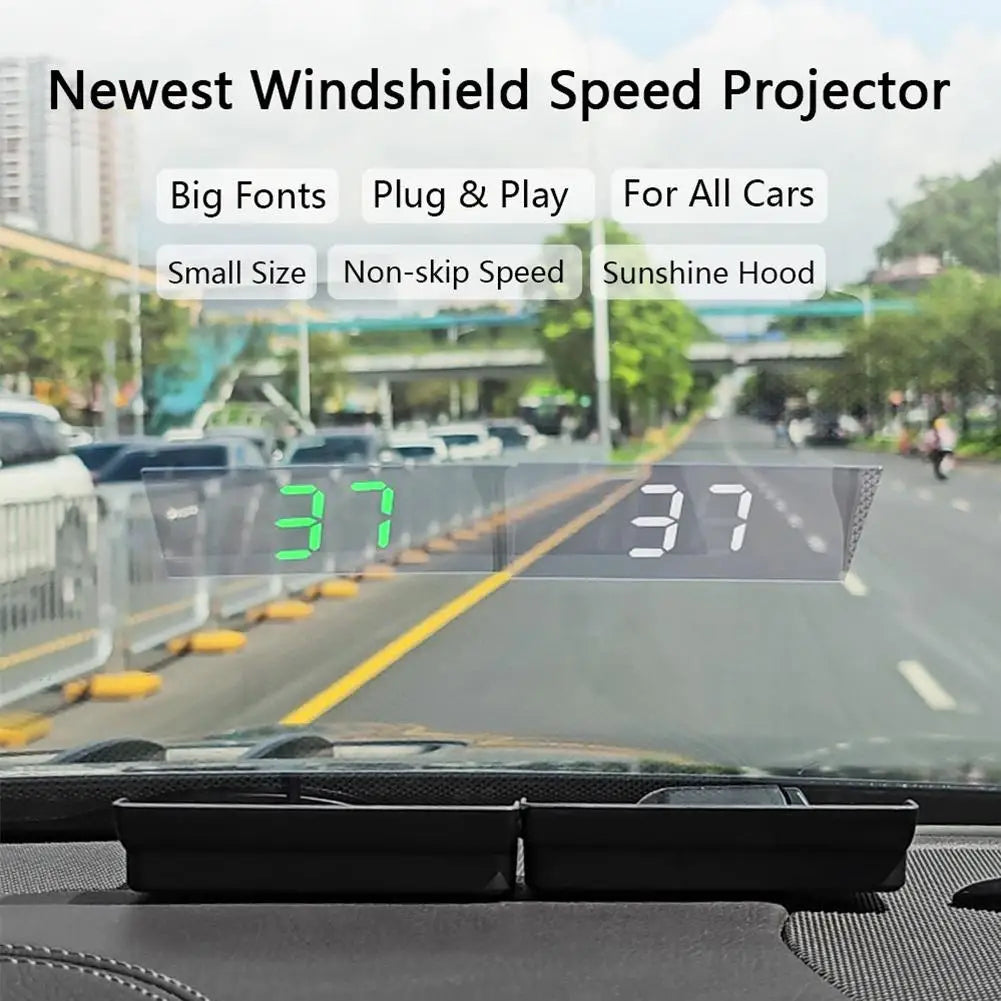 Head-up display projecting vehicle speed in green digits directly onto a car windshield during daylight driving conditions.