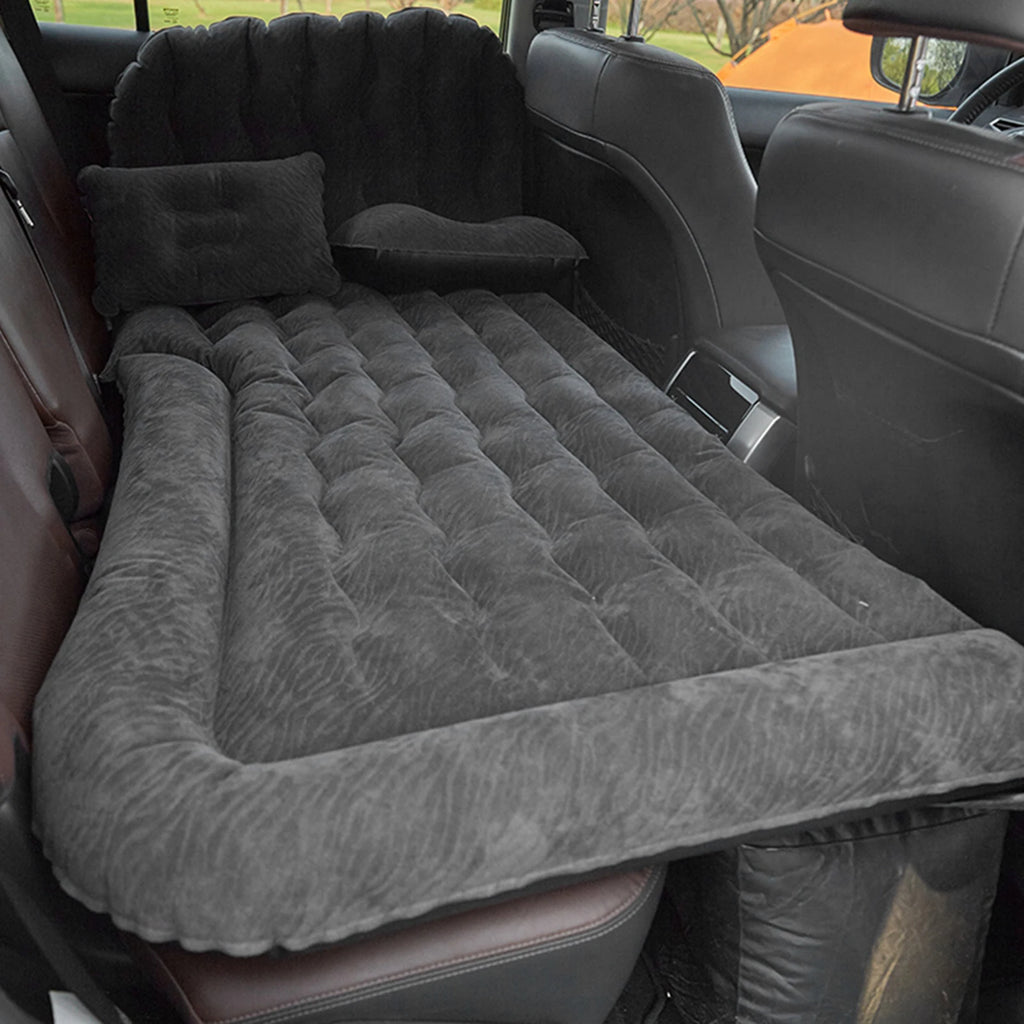 Inflatable car travel mattress configured for a passenger vehicle backseat, showing the footwell support section deployed to create a flat surface.
