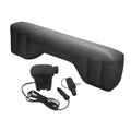 Black inflatable car travel bed extender displayed alongside an included 12-volt electric car air pump and three attachment nozzles on a white background.