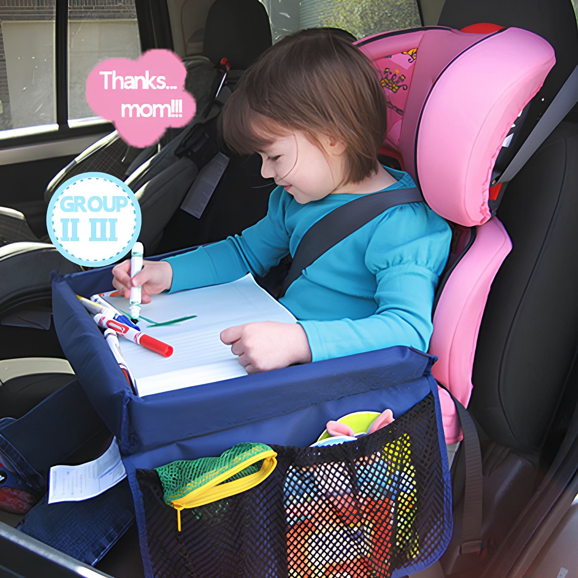 Young girl smiling and thanking mum while colouring on a blue kids car seat travel tray secured in the back seat