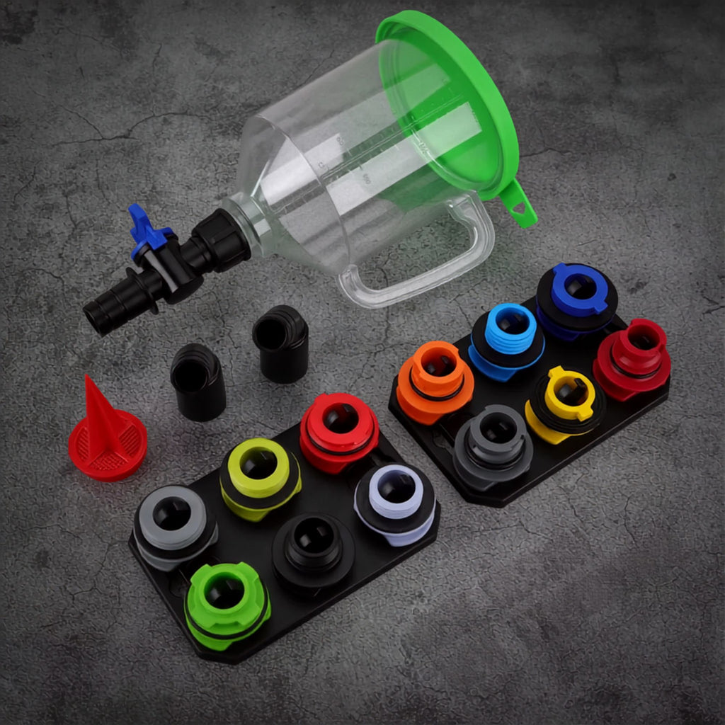 Engine oil funnel kit components laid out on a concrete surface including funnel, adapters and storage trays