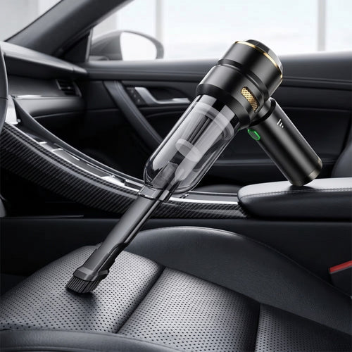 Cordless car vacuum cleaner with a brush nozzle attachment resting on the perforated black leather passenger seat of a luxury sports car.