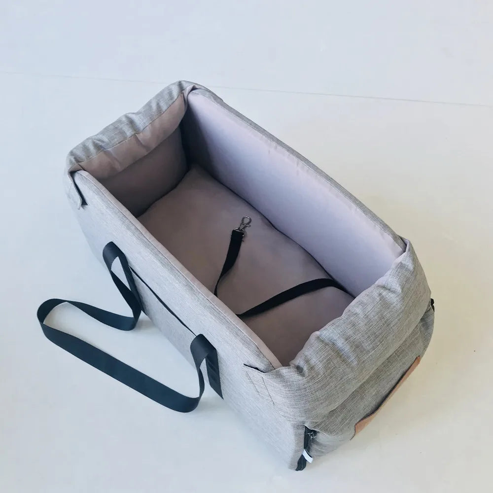 Empty ash grey spacious variant of the portable console dog booster seat with interior safety tether visible.