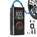 Black portable digital car tyre inflator displayed with the connecting air hose, USB charging cable, and four interchangeable nozzle adapters.