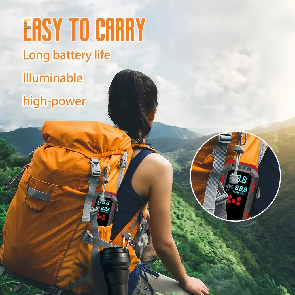 Portable jump starter unit secured to a hiking backpack, demonstrating scale and outdoor portability.
