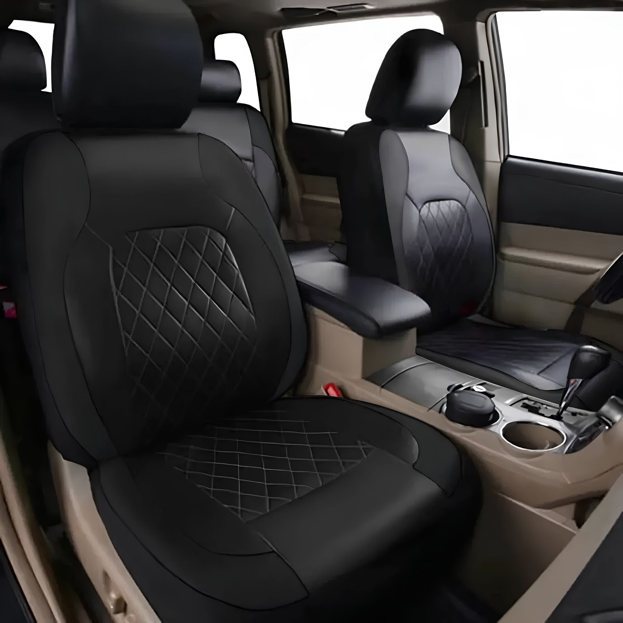 Black quilted faux leather car seat cover installed on the driver seat of a vehicle interior.
