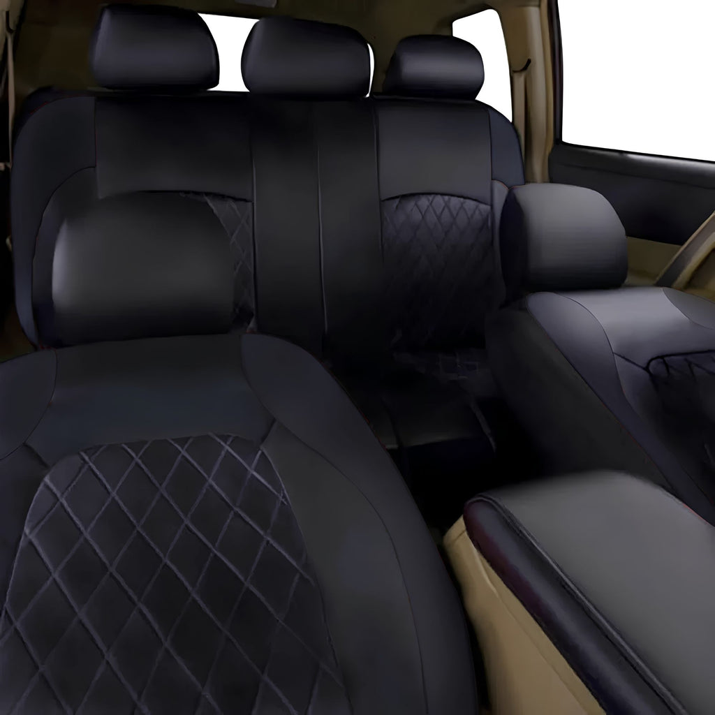 Rear bench configuration of black quilted faux leather car seat covers installed in a vehicle interior.