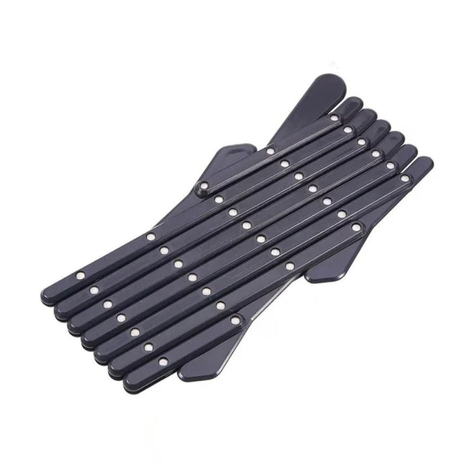 The small size variant of the black retractable car window pet barrier shown in its fully folded storage state.