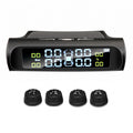 Solar-powered wireless tyre pressure monitoring system display unit alongside four DIY external tyre sensors, isolated on a white background.
