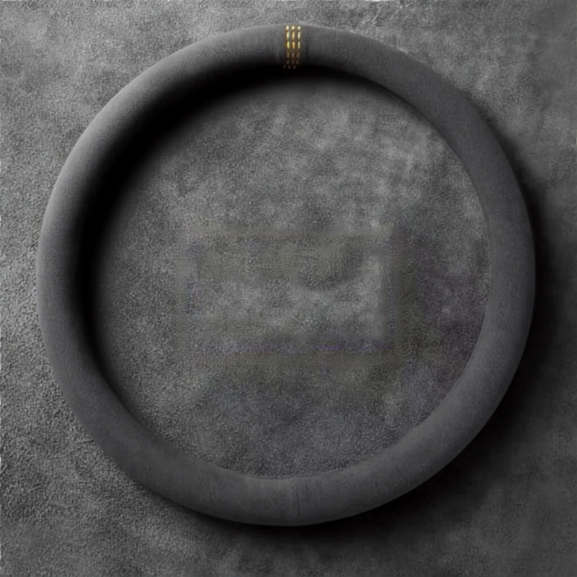 Round-style Steering Wheel Cover and Non-Slip Suede Grip Cover in black suede with yellow stitching, laid flat to show the fitted shape.