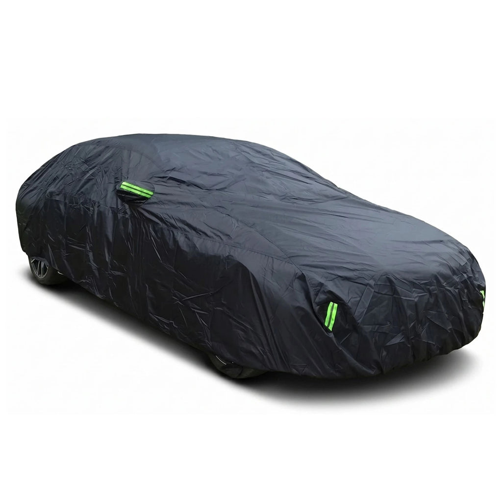 A black universal all-weather full car cover featuring green high-visibility reflective strips, installed on a vehicle against a white background.
