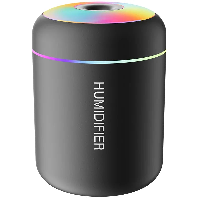 Stealth black USB portable car air humidifier and aroma diffuser featuring a cylindrical base, top mist outlet, and LED light ring.