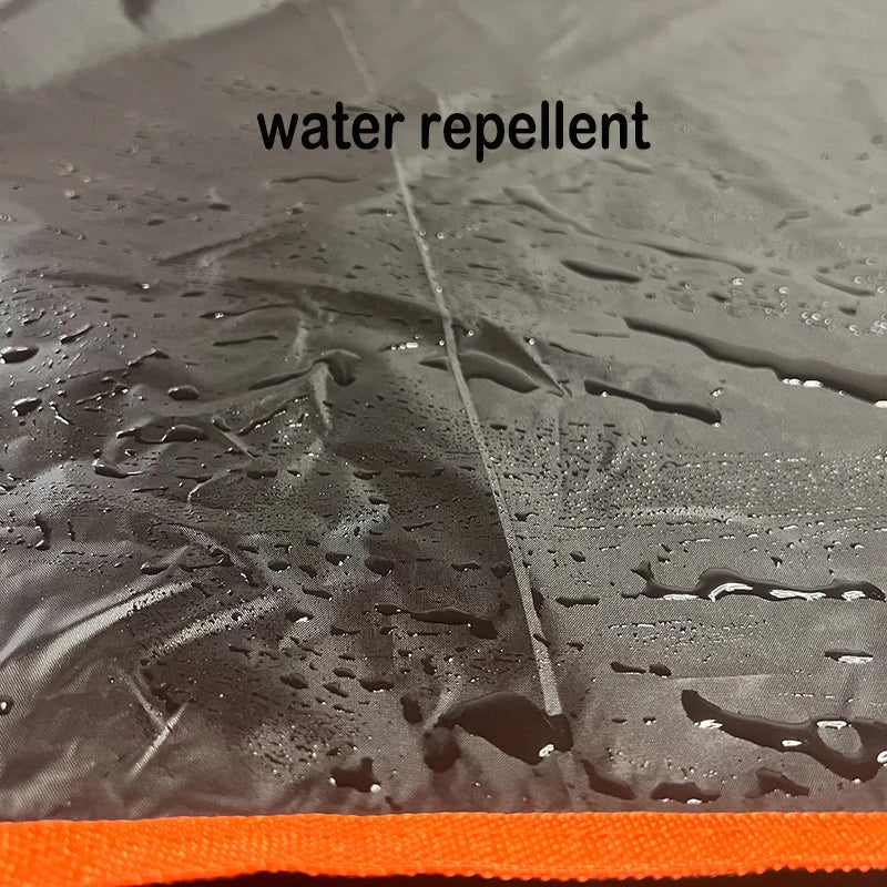 Close-up of water droplets beading on the surface of a water-repellent polyester SUV boot liner.