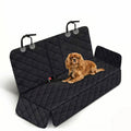 Waterproof black quilted pet car seat cover featuring a Cavalier King Charles Spaniel sitting on a pure white background.